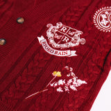 Ryoko Rain cable-knit cardigan close-up photo of floral and monogram embroidery