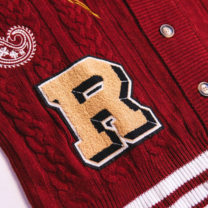 Ryoko Rain maroon cable-knit cardigan with gold / tan chenille patch