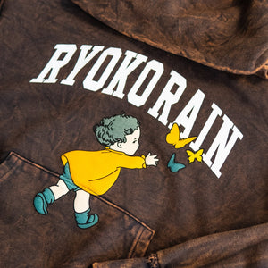 Ryoko Rain Chasing Butterflies Hoodie. Closeup photo of screen printed white "Ryoko Rain" logo and little girl chasing butterflies on a distressed copper hoodie